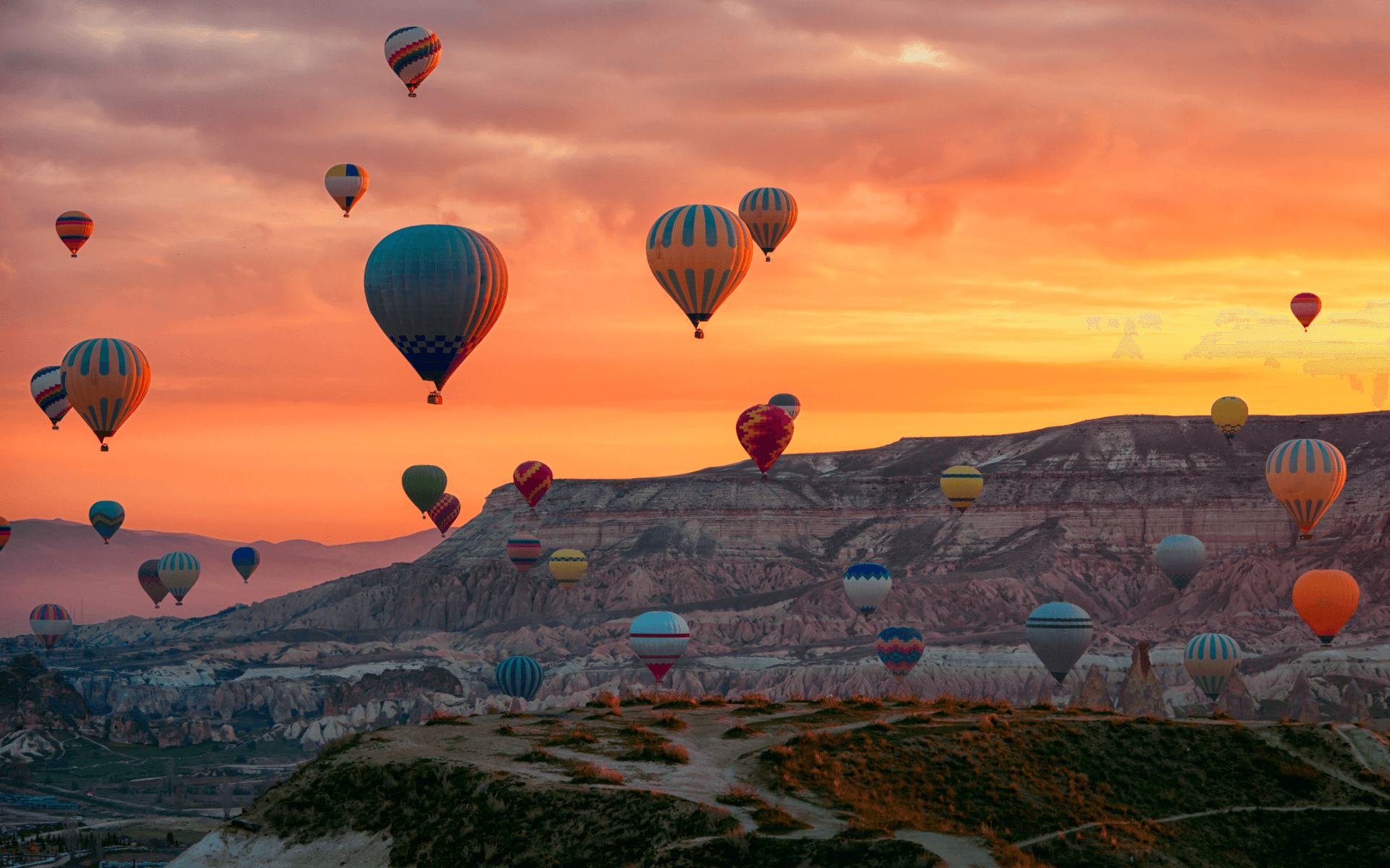 Aerial view of hot air balloons in Goreme National Park sky